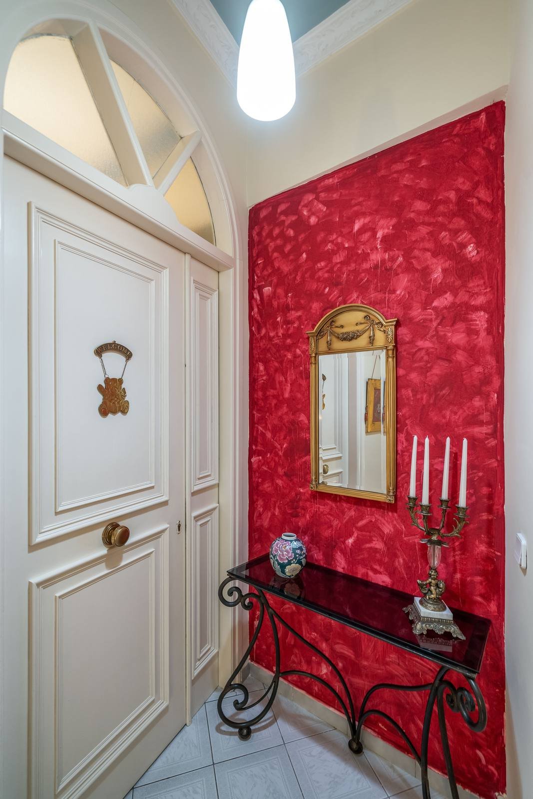 First-floor landing with a red damask wall