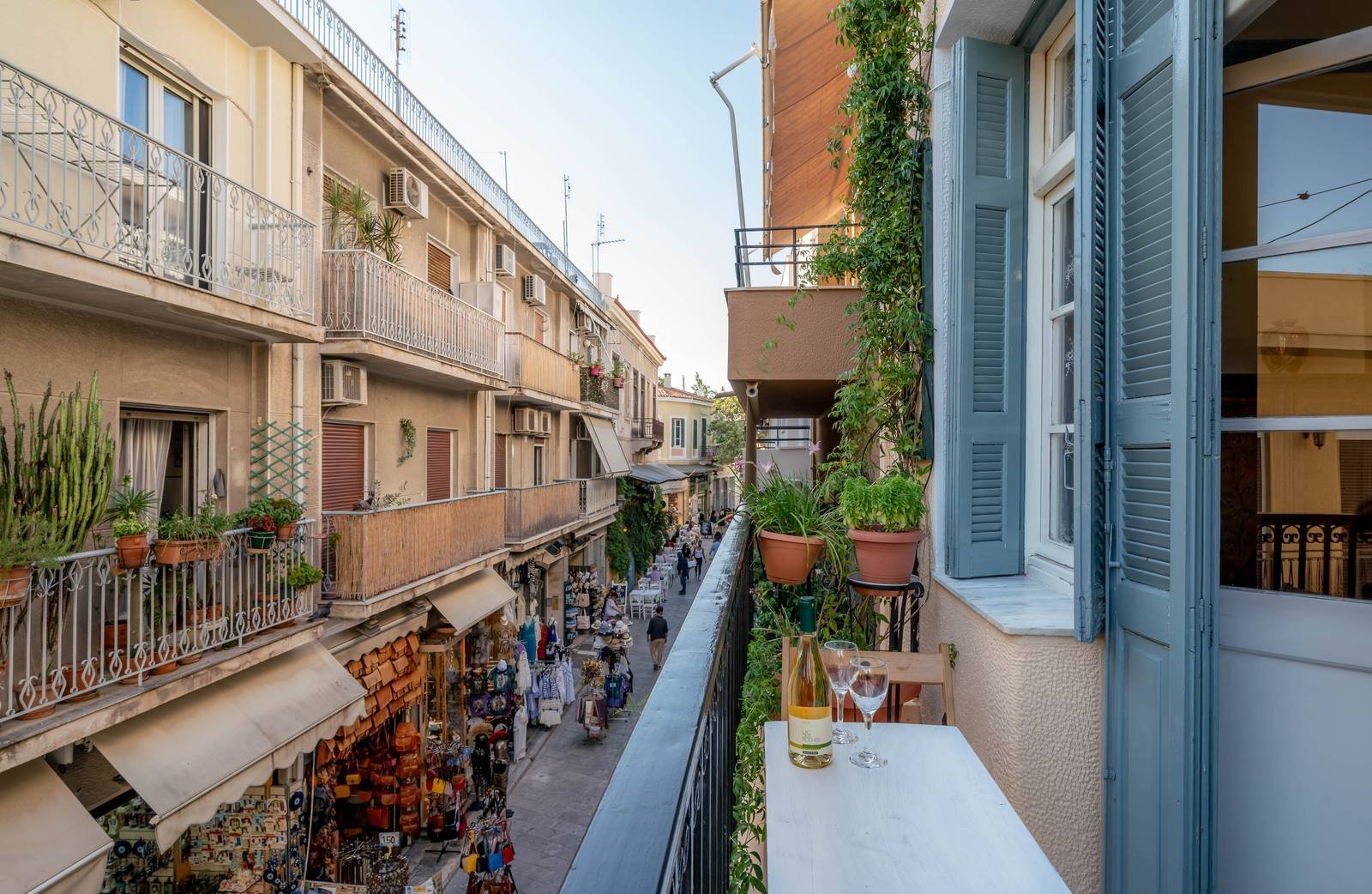 Adrianou Street with shops and passers-by, seen from the balcony
