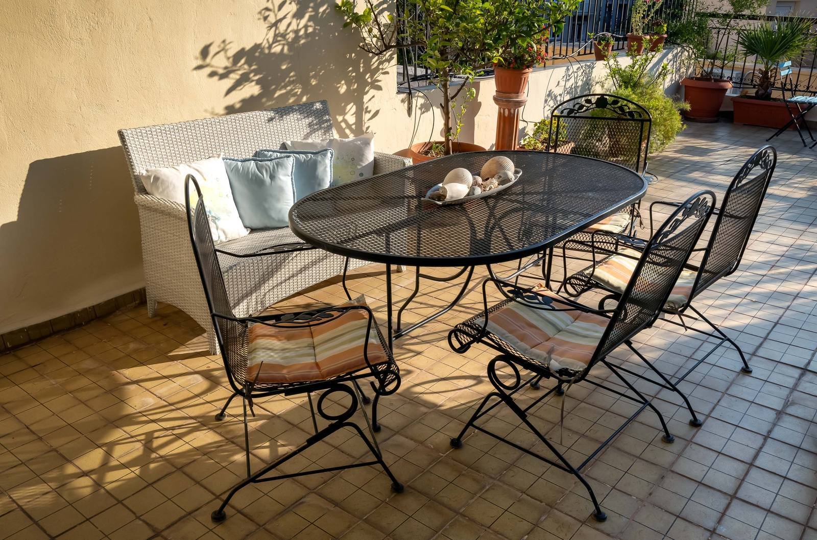 The terrace with dining table and lounge seating
