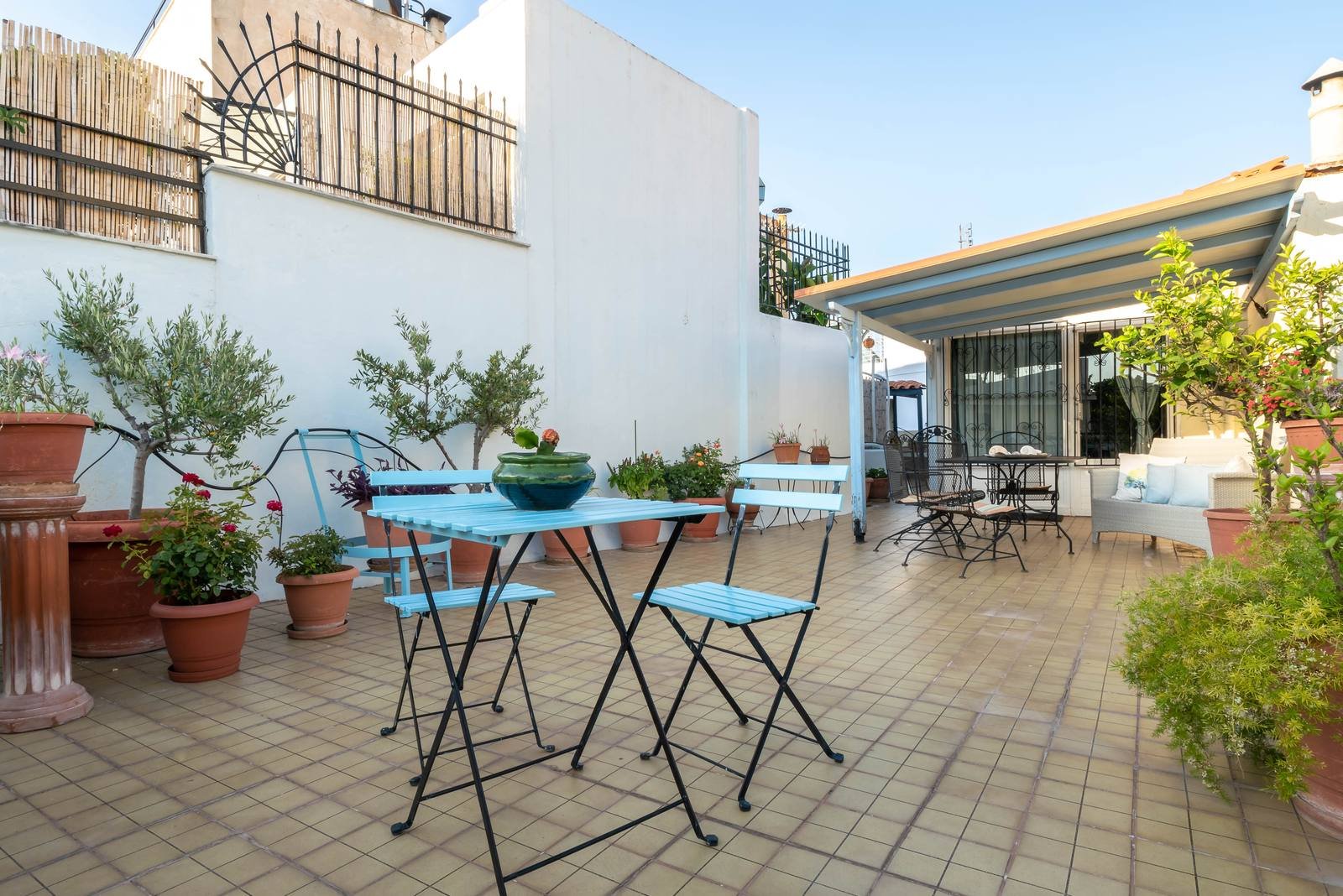 The terrace with a small table and plants